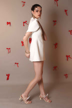 Ivory Bow-Back Mini Dress with Puff Sleeves – Pearl Button Detail - Vybtheory