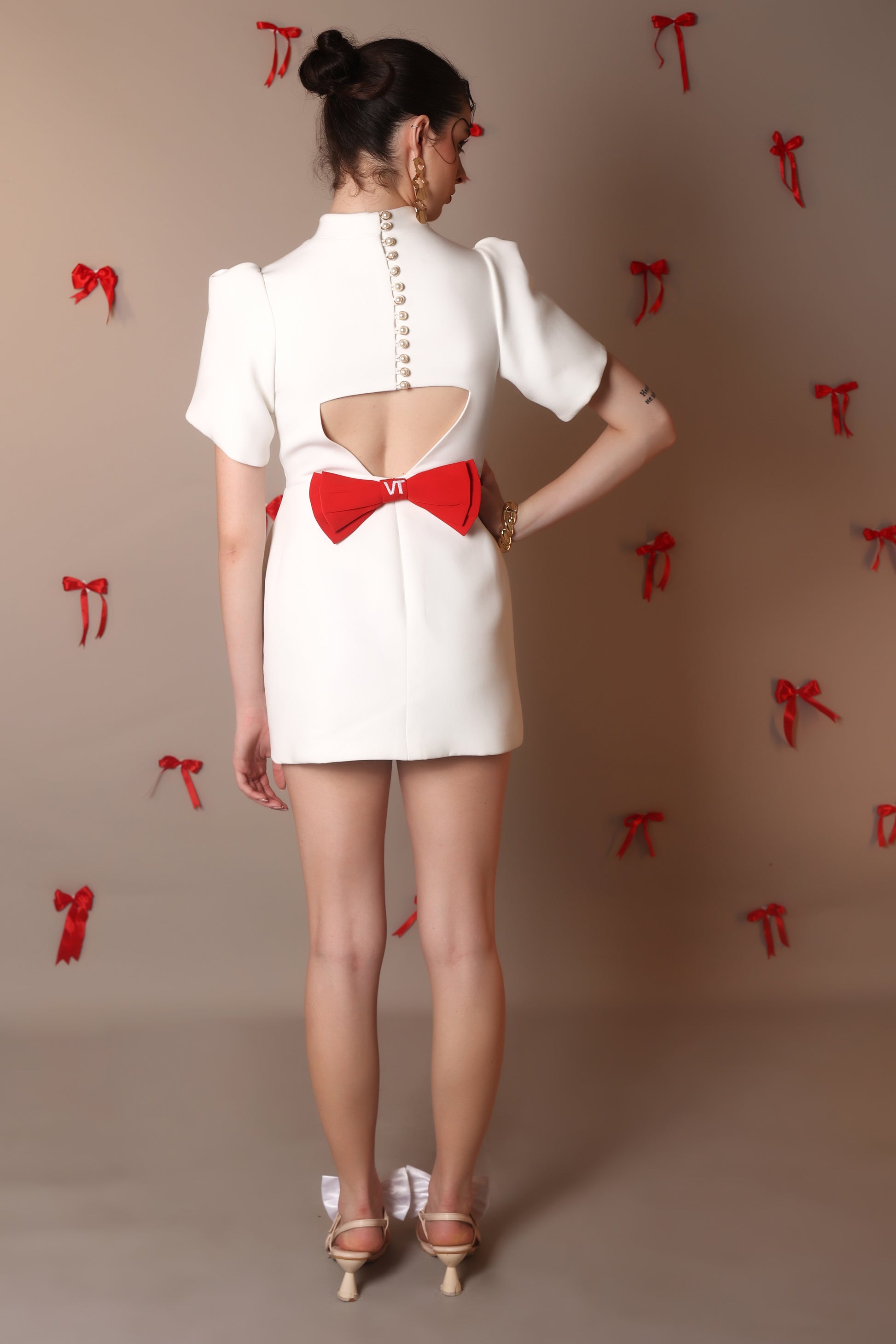 Ivory Bow-Back Mini Dress with Puff Sleeves – Pearl Button Detail