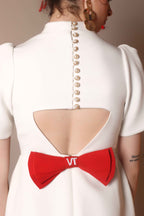 Ivory Bow-Back Mini Dress with Puff Sleeves – Pearl Button Detail - Vybtheory