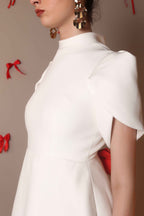 Ivory Bow-Back Mini Dress with Puff Sleeves – Pearl Button Detail - Vybtheory