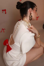 Ivory Bow-Back Mini Dress with Puff Sleeves – Pearl Button Detail - Vybtheory